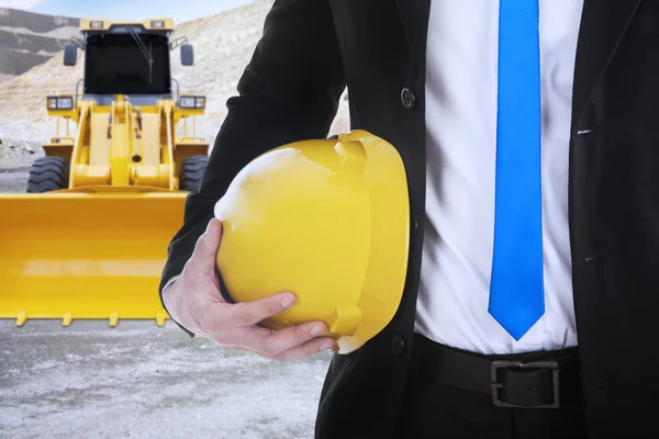 Businessman with backhoe on the construction — Stock Photo, Image