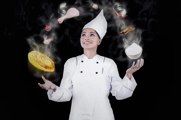 Chef cucina con magia indossando uniforme — Foto Stock