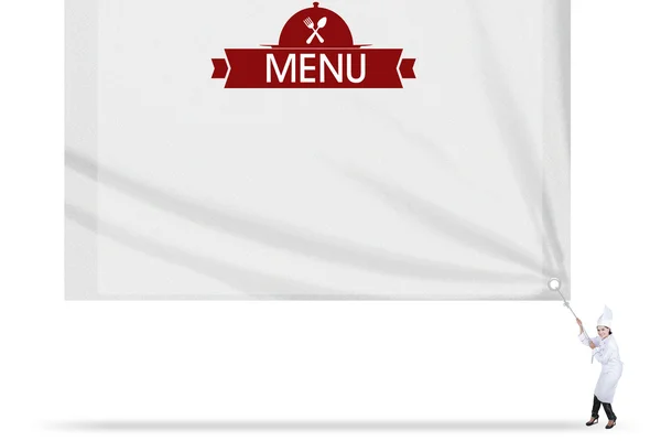 Молодий шеф-кухар тягне текст меню на прапор — стокове фото