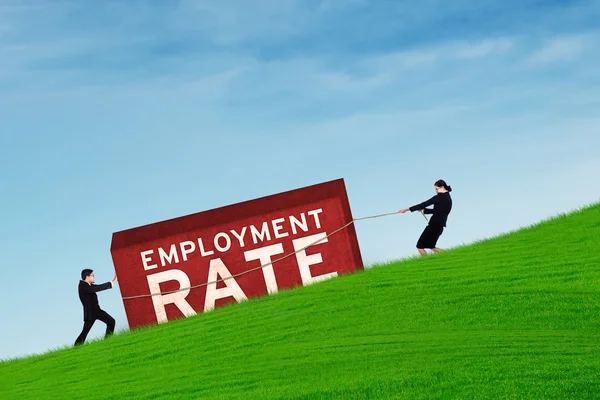 Workers moving an employment rate text — Stock Photo, Image