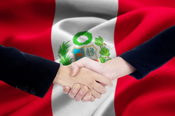 Agreement handshake with flag of Peru — Stock Photo, Image