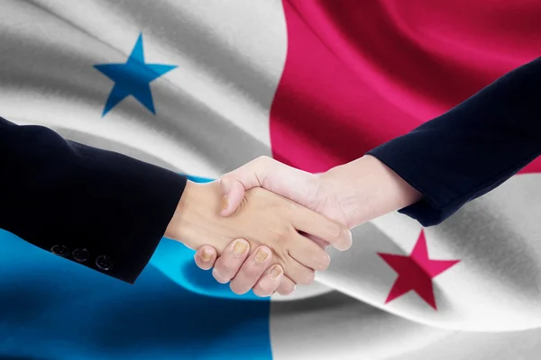 Meeting handshake with flag of Panama — Stock Photo, Image