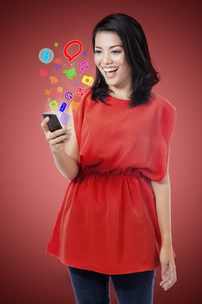 Asian girl holding mobile phone — Stock Photo, Image