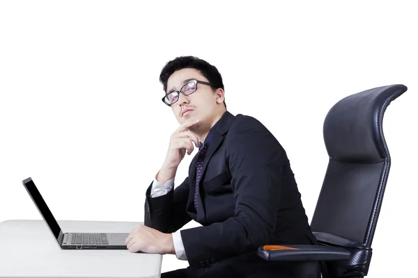 Businessman looking up at camera — Stock Photo, Image