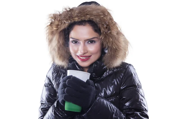 Indian woman with winter clothes holds hot coffee — Stock Photo, Image