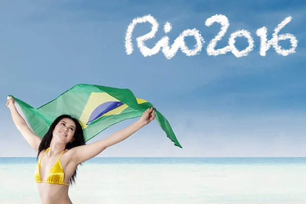 Woman holding Brazilian flag — Stock Photo, Image