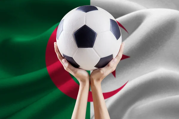 Ball on the arms with flag of Algeria — Stock Photo, Image