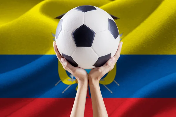 Ball on the hands with flag of Ecuador — Stock Photo, Image