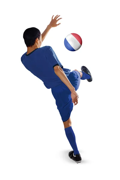 Football player kicks a ball — Stock Photo, Image