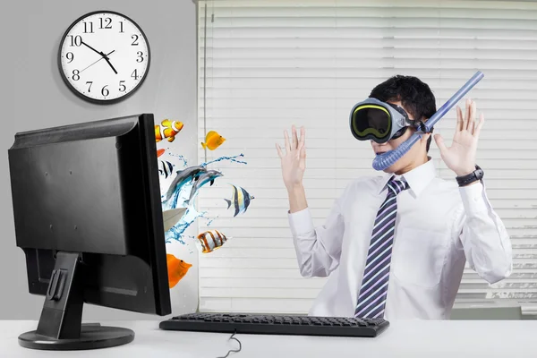 Shocked worker with fishes on monitor — Stock Photo, Image