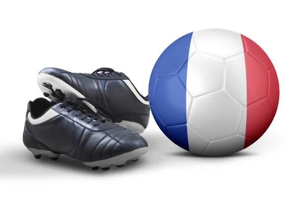 Chaussures de football et ballon en studio — Photo