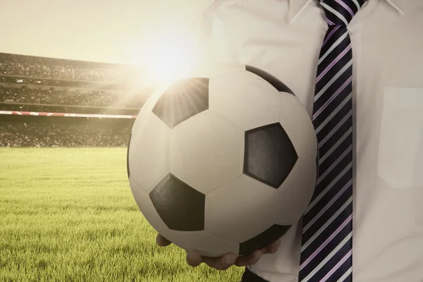 Man holds a ball and wearing formal suit — Stock Photo, Image