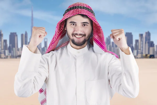 Arabian man expressing his success outdoors — Stock Photo, Image