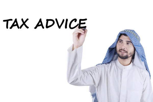 Arabian person writes text of Tax Advice — Stock Photo, Image