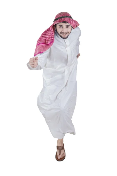 Empresário árabe correndo em estúdio — Fotografia de Stock