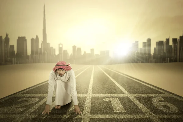 Arabic man with numbers 2016 on street — Stock Photo, Image