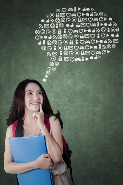 Female student with web icons — Stock Photo, Image