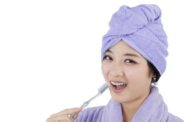 Young girl holding a toothbrush — Stock Photo, Image