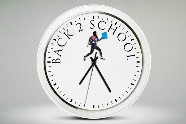 Student jumps on the clock — Stock Photo, Image