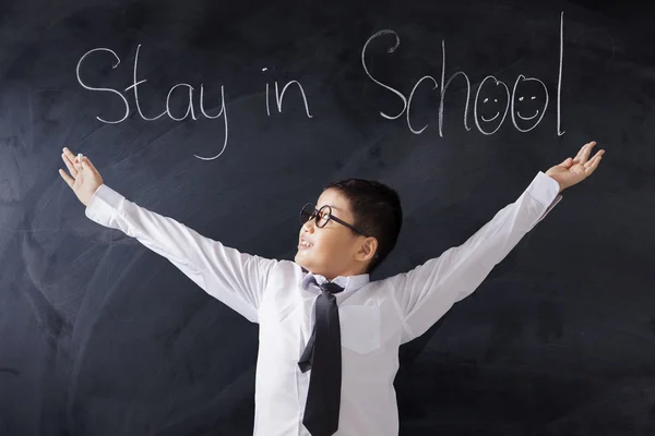 Estudante bonito com texto de Stay in School — Fotografia de Stock