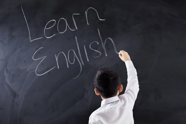 Gyermek megtanul angol szöveget írja — Stock Fotó