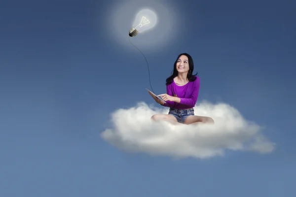 College student with tablet on the cloud — Stock Photo, Image