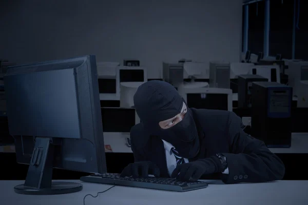 Robber takes information in office — Stock Photo, Image