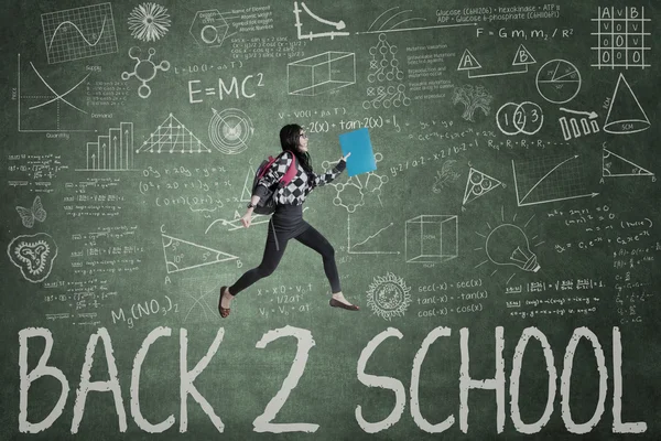 Female student and text of Back to School — Stock Photo, Image