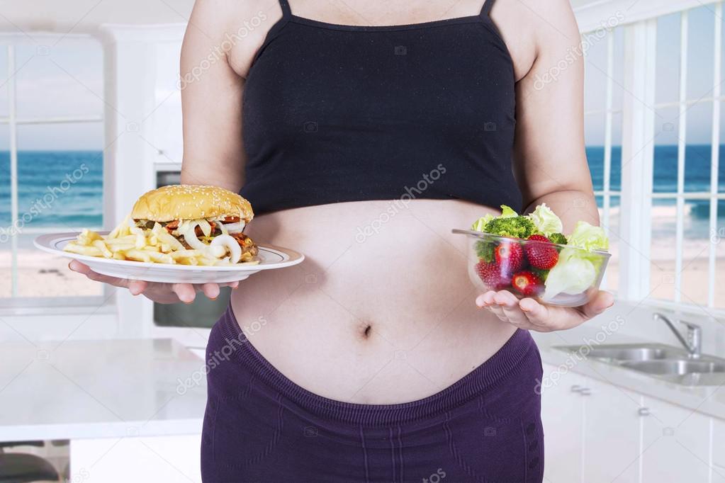 Fast food and healthy food for pregnancy — Stock Photo ... Fast food and healthy food for pregnancy — Stock Photo ...