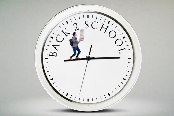 Male student walks on the clock — Stock Photo, Image