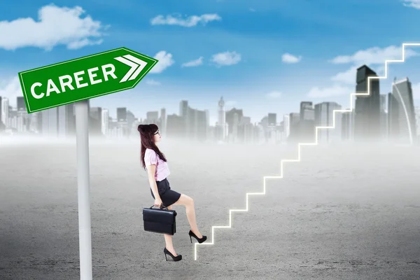 Female worker climbing stairway — Stock Photo, Image