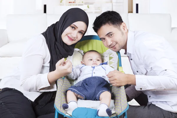 Arabian family with their son in stroller — Stock Photo, Image