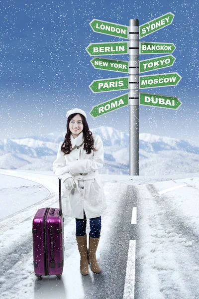 Pretty girl and destinations for winter holiday — Stock Photo, Image