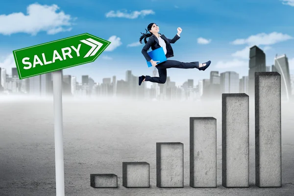 Businesswoman runs above salary chart — Stock Photo, Image