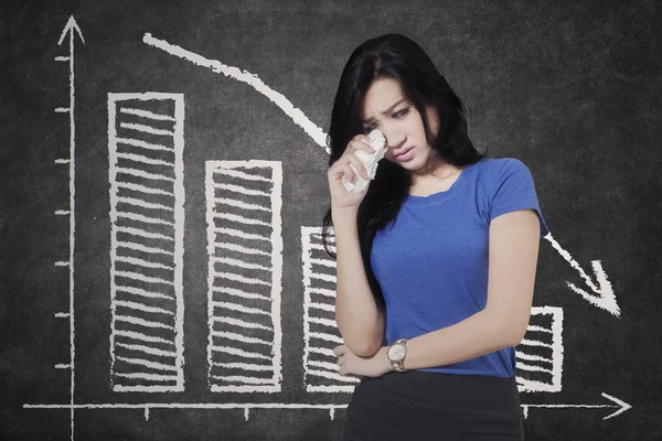 Sad woman and declining graph — Stock Photo, Image