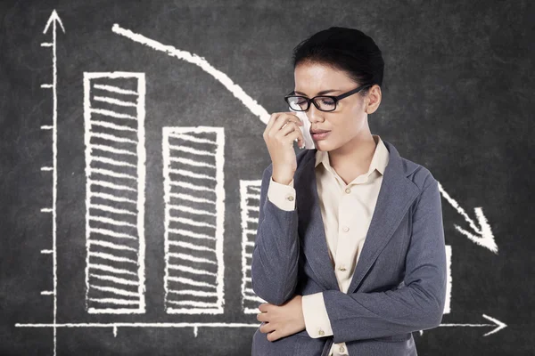 Crying woman and declining chart — Stock Photo, Image