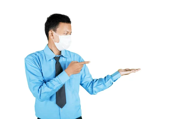 Young Businessman Wearing Face Mask While Showing Something His Hands — Stock Photo, Image