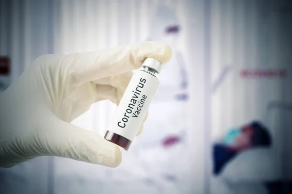 Close Doctor Hands Holding Coronavirus Vaccine Bottle Blurred Infected Patient — Stock Photo, Image