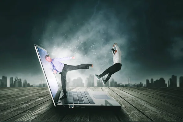 Close up of Caucasian businessman kicking out his rival from a laptop with modern city background