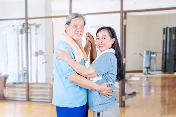 Senior Couple Wearing Sportswear Smiling Camera While Dancing Together Fitness — Stock Photo, Image