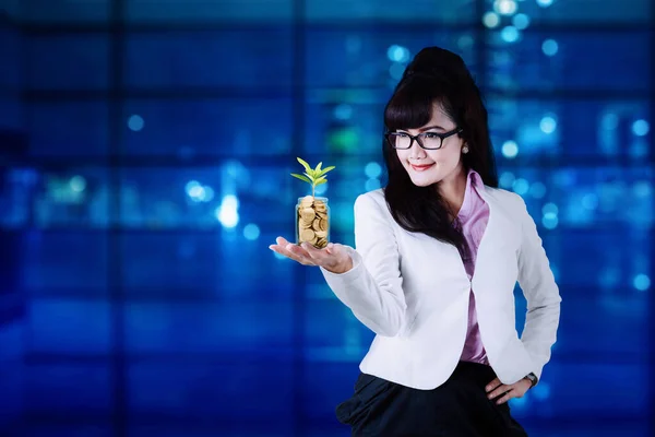 Young Businesswoman Holding Glass Jar Money Tree While Standing Office — ストック写真
