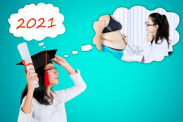 Close Graduate Female Student Looks Happy While Imagining Dream Being — Stock Photo, Image