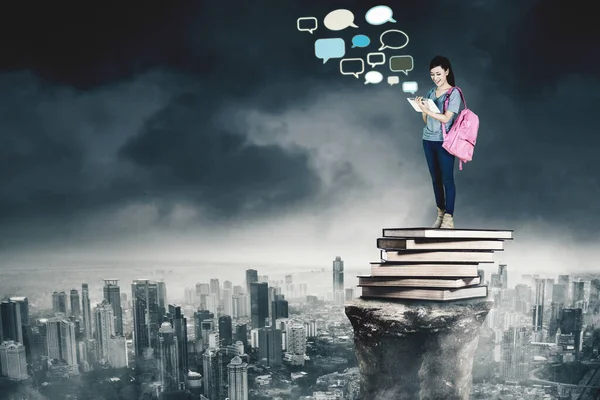 Female Student Using Digital Tablet Empty Cloud Speech Bubbles While — Stock Photo, Image