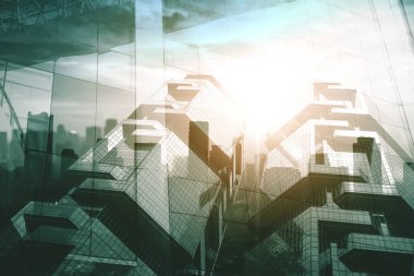 Modern şehrin arka planında çift pozlu ikiz binaların düşük açılı görüntüsü. Alacakaranlıkta vuruldu