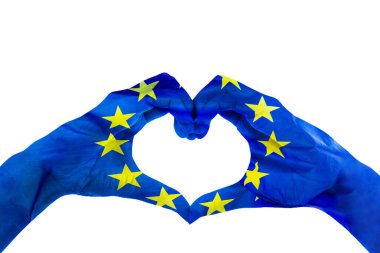 Close up of unknown hands making heart symbol patterned with European Union flag in the studio. Isolated on white background