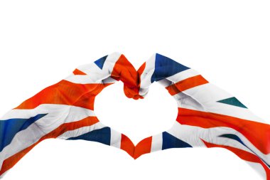 Close up of unknown hands making heart symbol patterned with United Kingdom flag in the studio. Isolated on white background