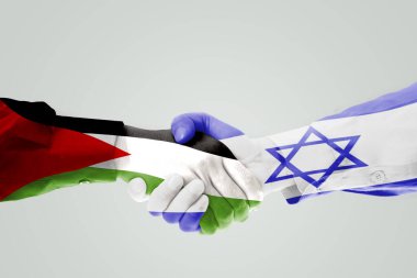 Close up of two hands people handshaking each other with Israel and Palestine flag