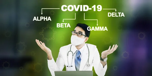 Male doctor feeling confused while thinking prevention of covid-19 mutation variants in the hospital