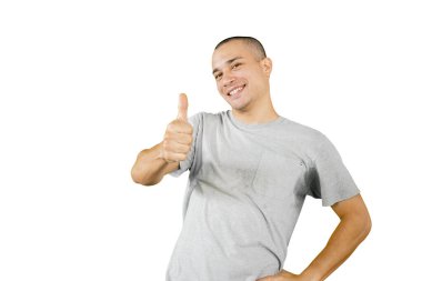 Picture of Caucasian man smiling at the camera while showing thumb up and standing in the studio. Isolated on white background