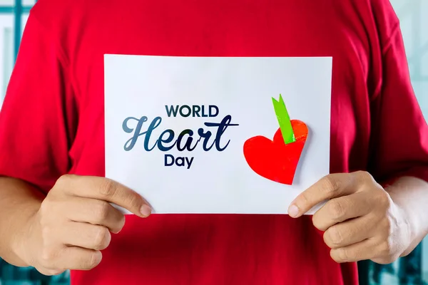 Close Young Man Hands Holding White Paper Red Heart Symbol — Foto Stock